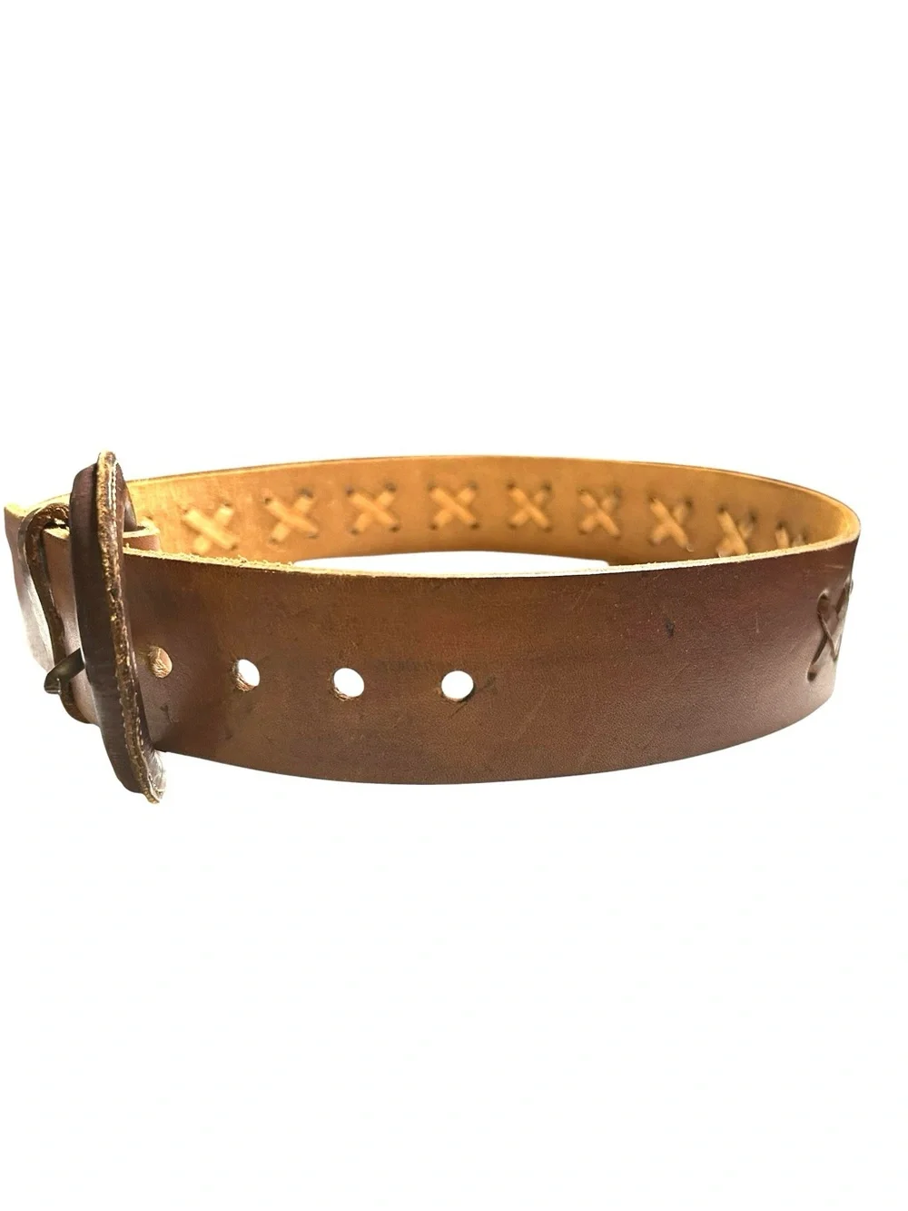 Brown leather belt with X-weave crisscross stitched along the strap.